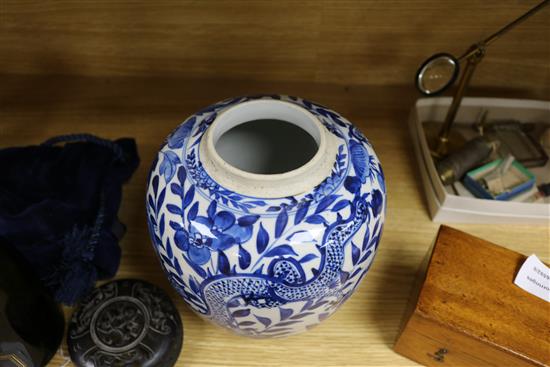 A Chinese blue and white jar, with hardwood cover height 22cm